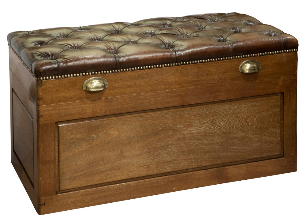 Camphor wood trunk with leather top.