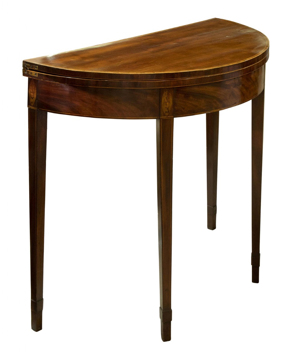 A Georgian mahogany demi lune card table