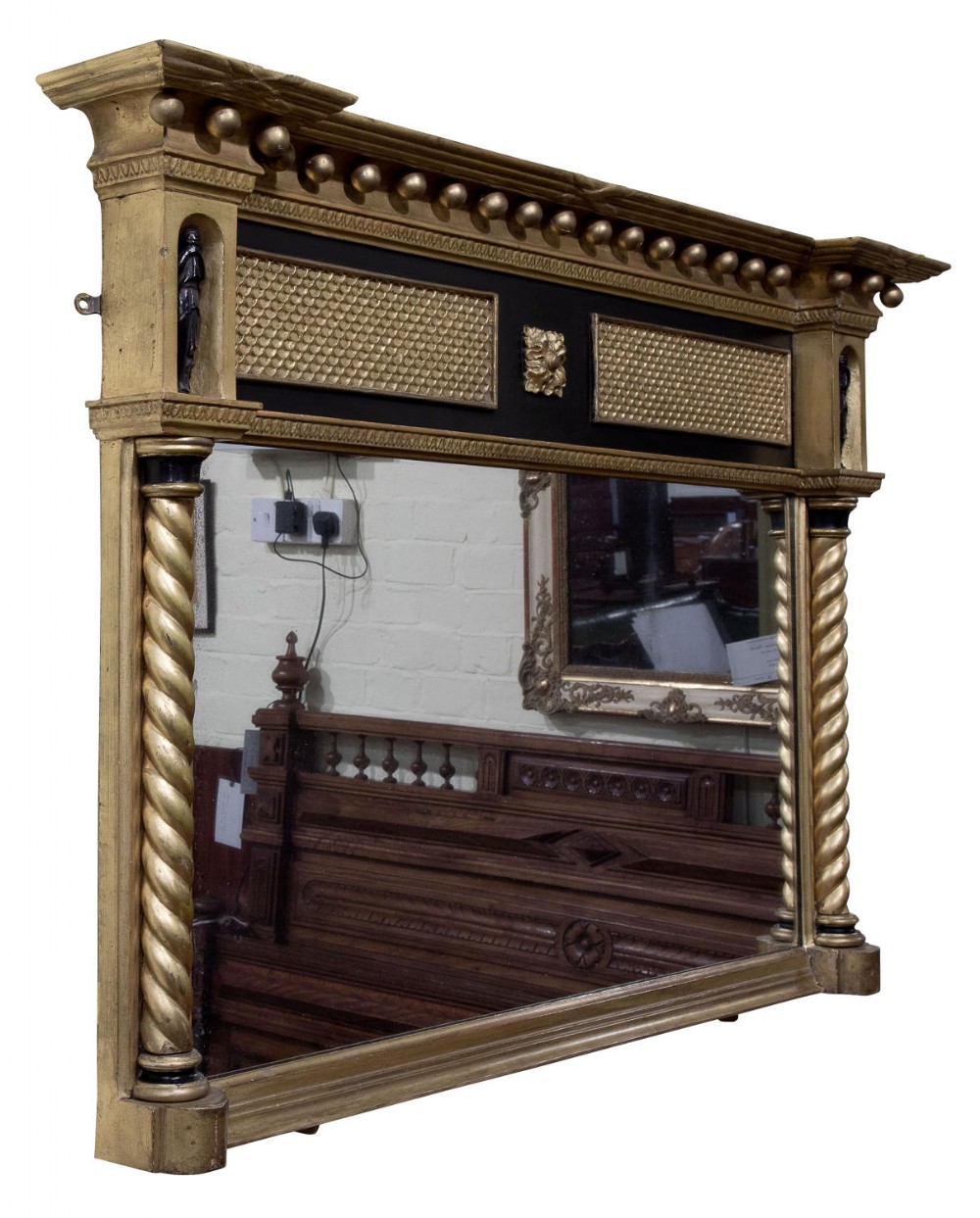 Gilded and ebonised over mantel mirror