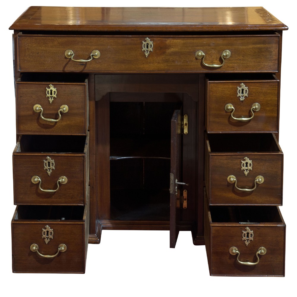 Striking George III mahogany kneehole desk with original hardware View II