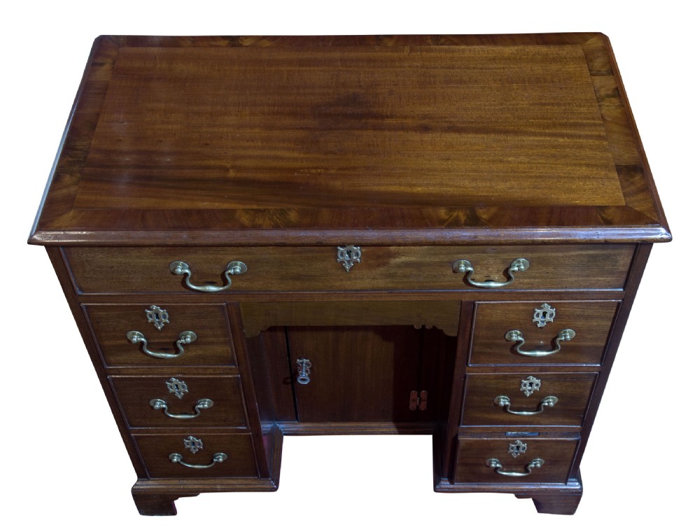 Striking George III mahogany kneehole desk with original hardware View IV