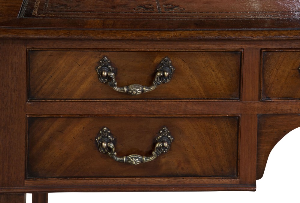 Mahogany five drawer writing table with antique wine leather top c1900 View V