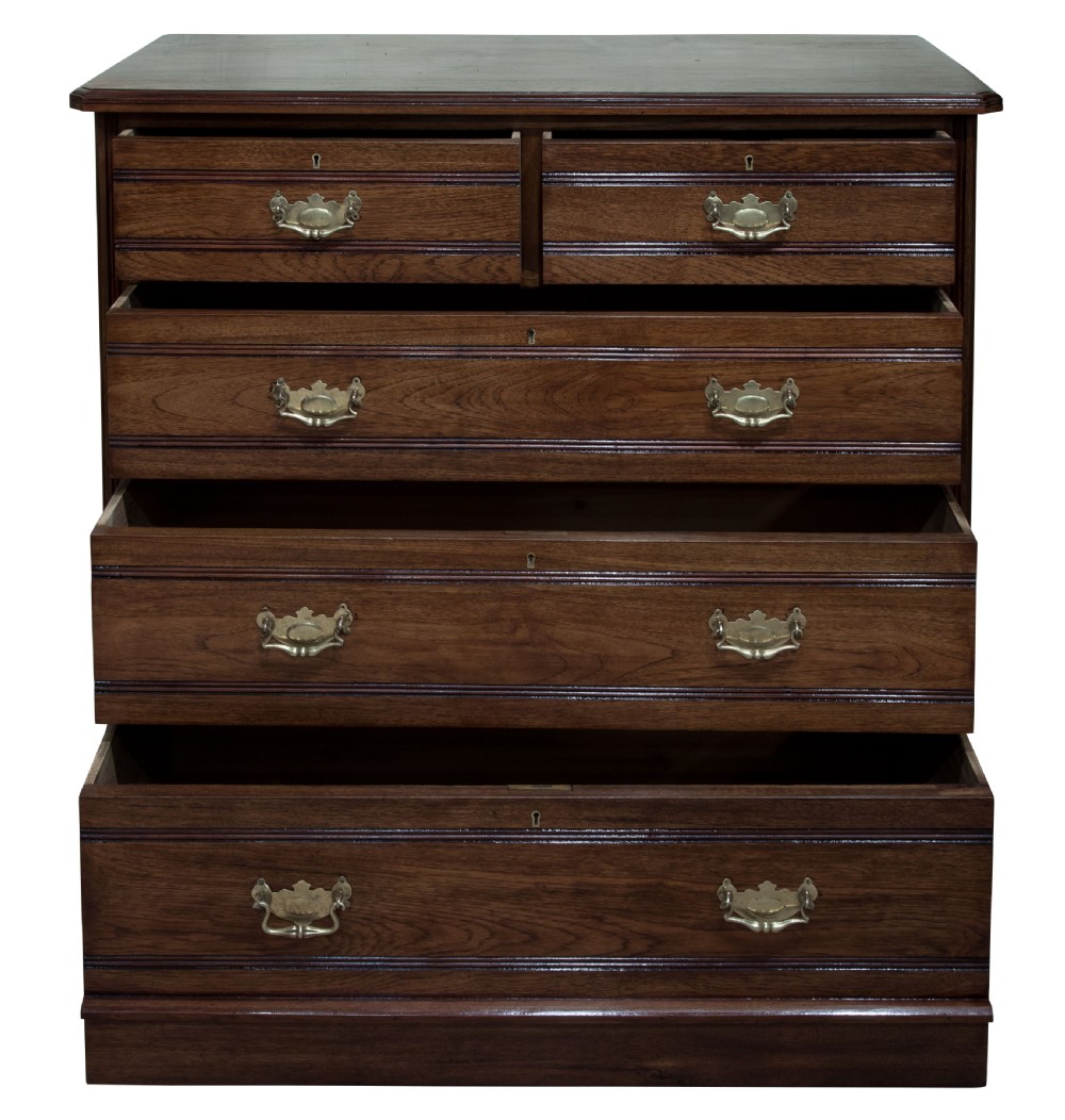 Late Victorian solid walnut 'tramline' chest of five drawers c1890 View II