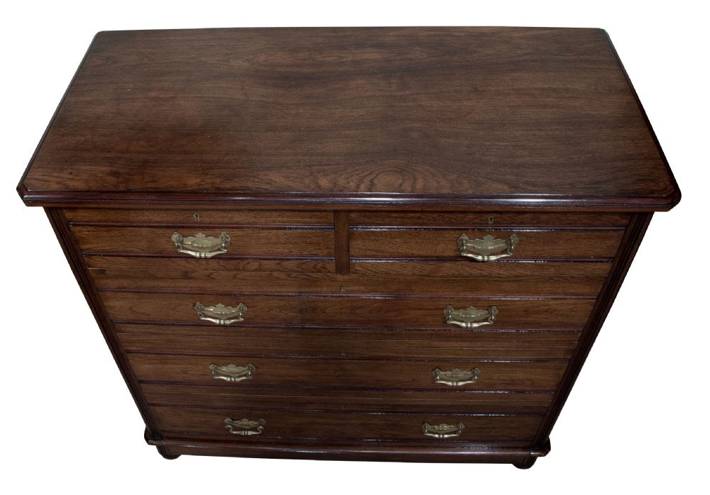 Late Victorian solid walnut 'tramline' chest of five drawers c1890 View III