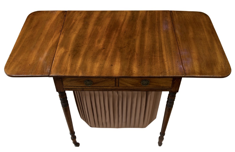Regency period sewing/sofa table standing on fine turned legs View V