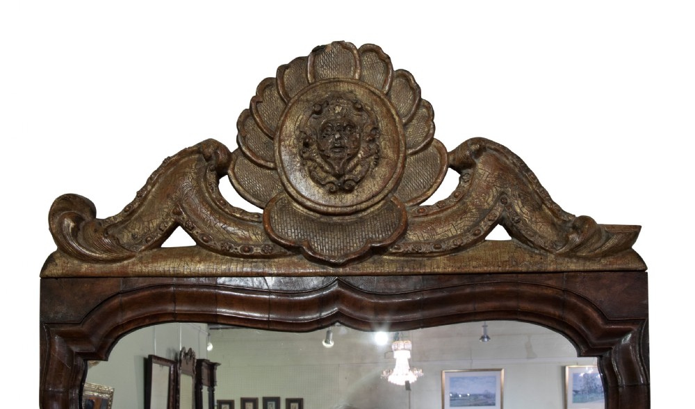 Tall early 18thC walnut frame wall mirror with arched carved gilt top View IV