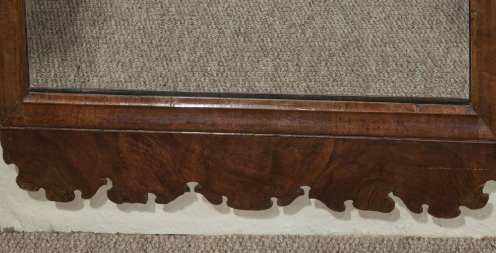 Tall early 18thC walnut frame wall mirror with arched carved gilt top View VI