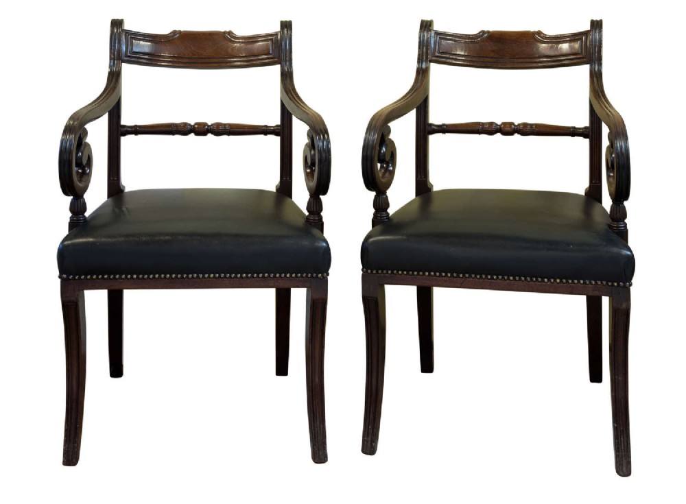 Pair of Regency Mahogany Elbow Chairs on sabre front legs c1815