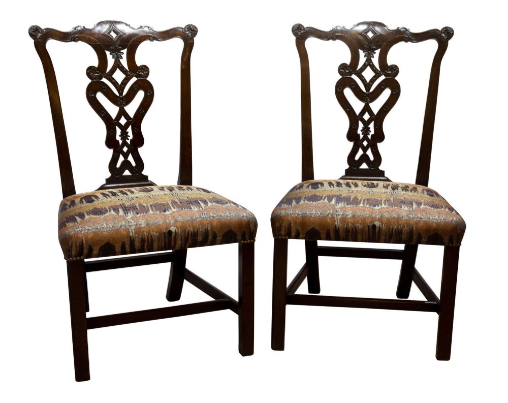 Pair of George III Chippendale period carved mahogany side chairs
