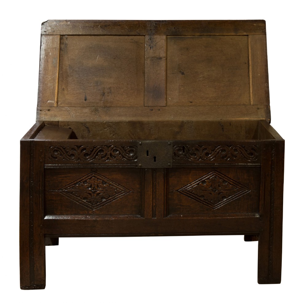 Mid 17thC panelled oak coffer with carved running strap work c1650 View IV