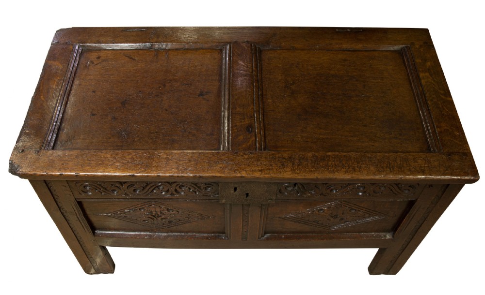 Mid 17thC panelled oak coffer with carved running strap work c1650 View V