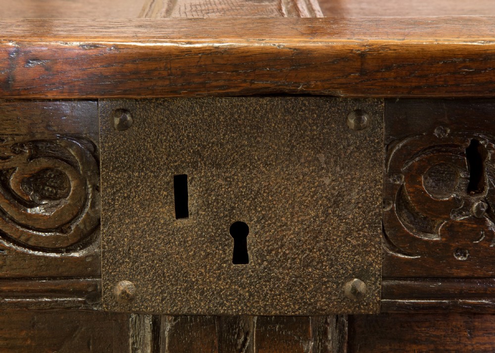 Mid 17thC panelled oak coffer with carved running strap work c1650 View X