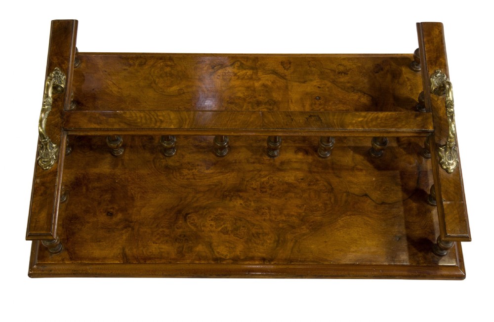 A Victorian figured walnut twin section book tray View V