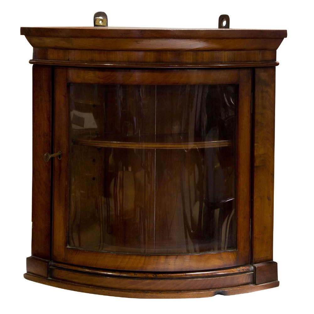 Small mahogany bow-fronted corner cabinet