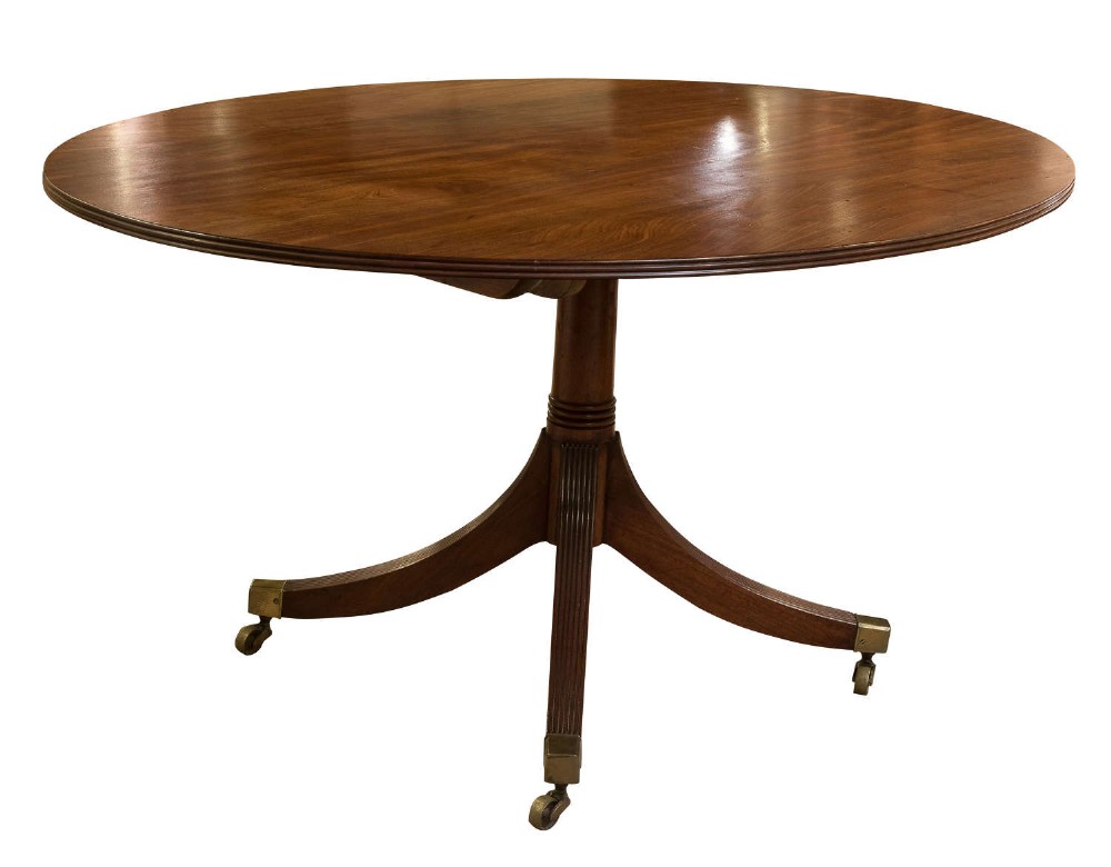 Regency mahogany oval breakfast table on turned pillar legs c1820