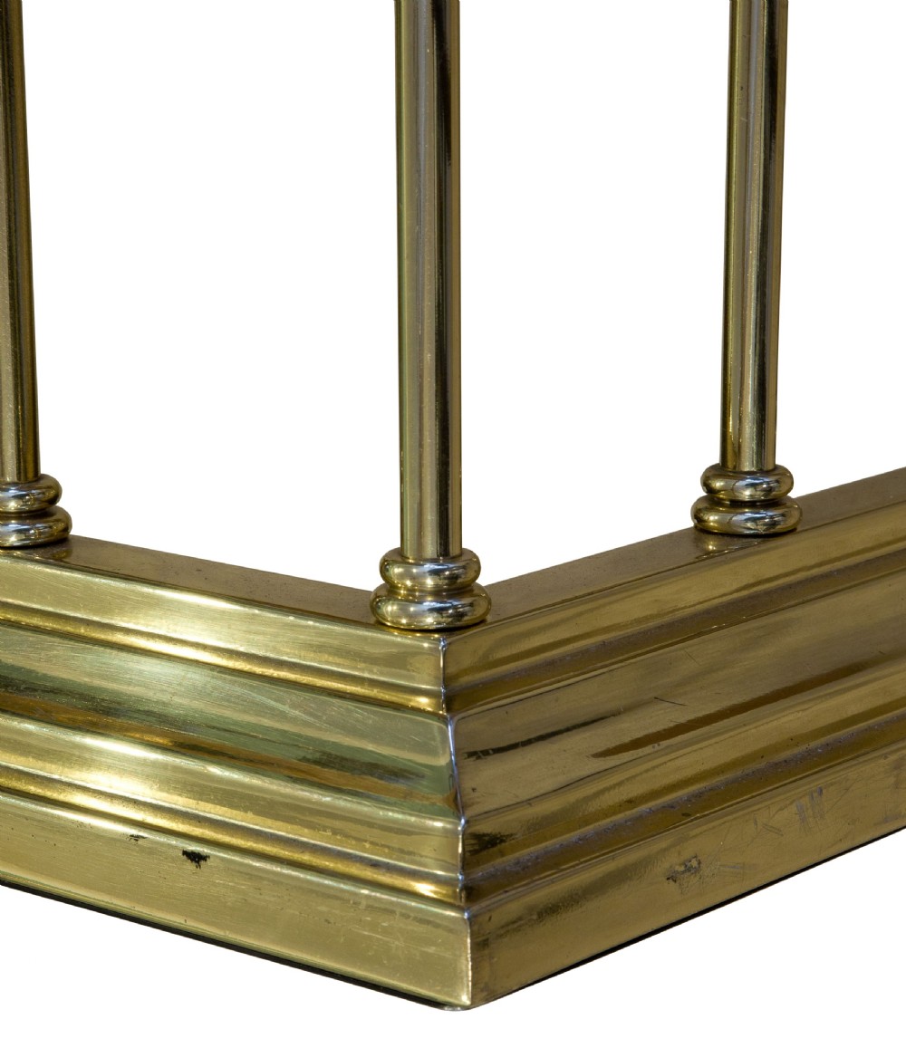 A Brass and Upholstered Club Fender View V