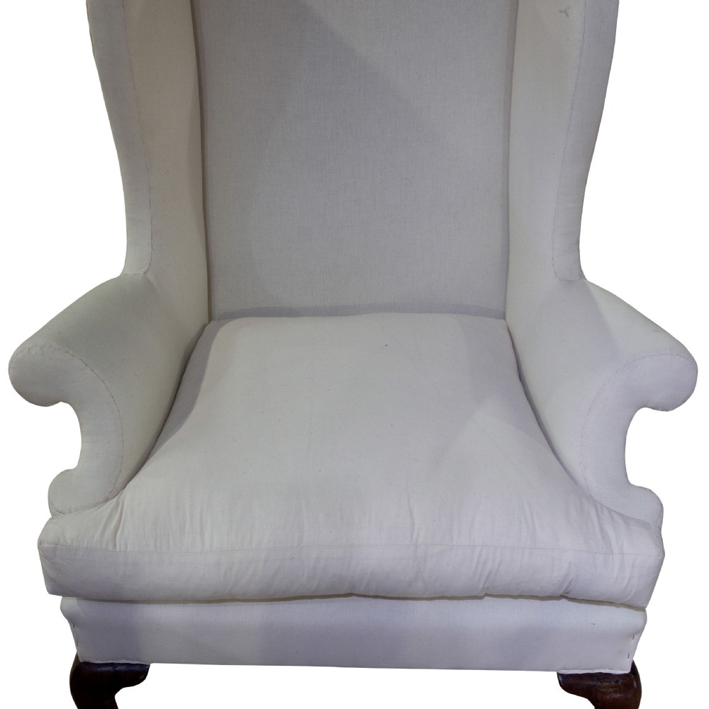 A finely drawn Queen Anne walnut wing armchair c1710 View V