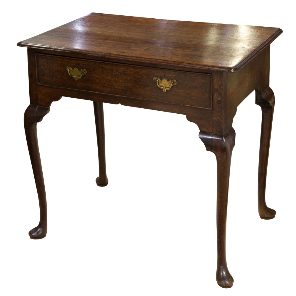 A George II Oak single drawer side table with original brass handles