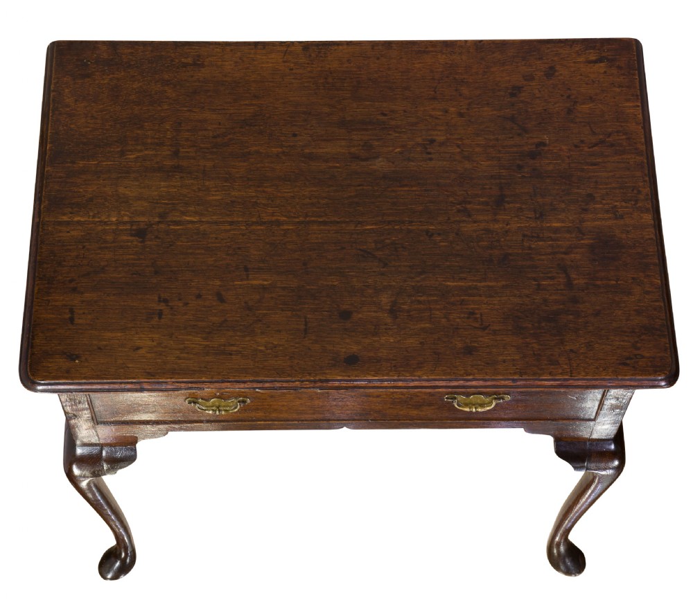 A George II Oak single drawer side table with original brass handles View V