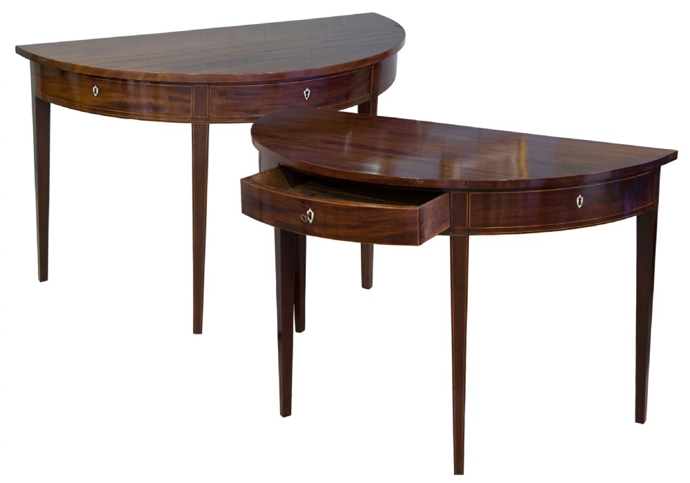A fine pair of George III Mahogany demi lune side tables