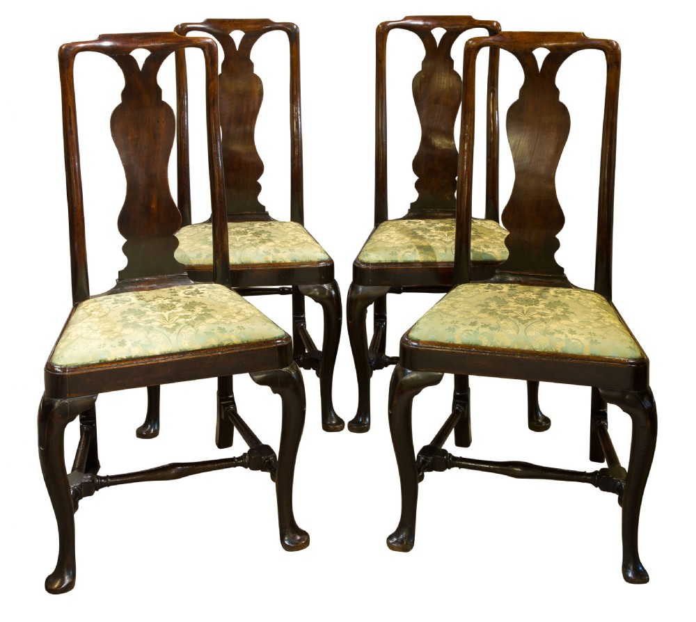 A fine set of four Geo I Walnut high back chairs