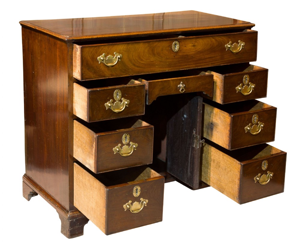 A George III small kneehole desk of six drawers View III
