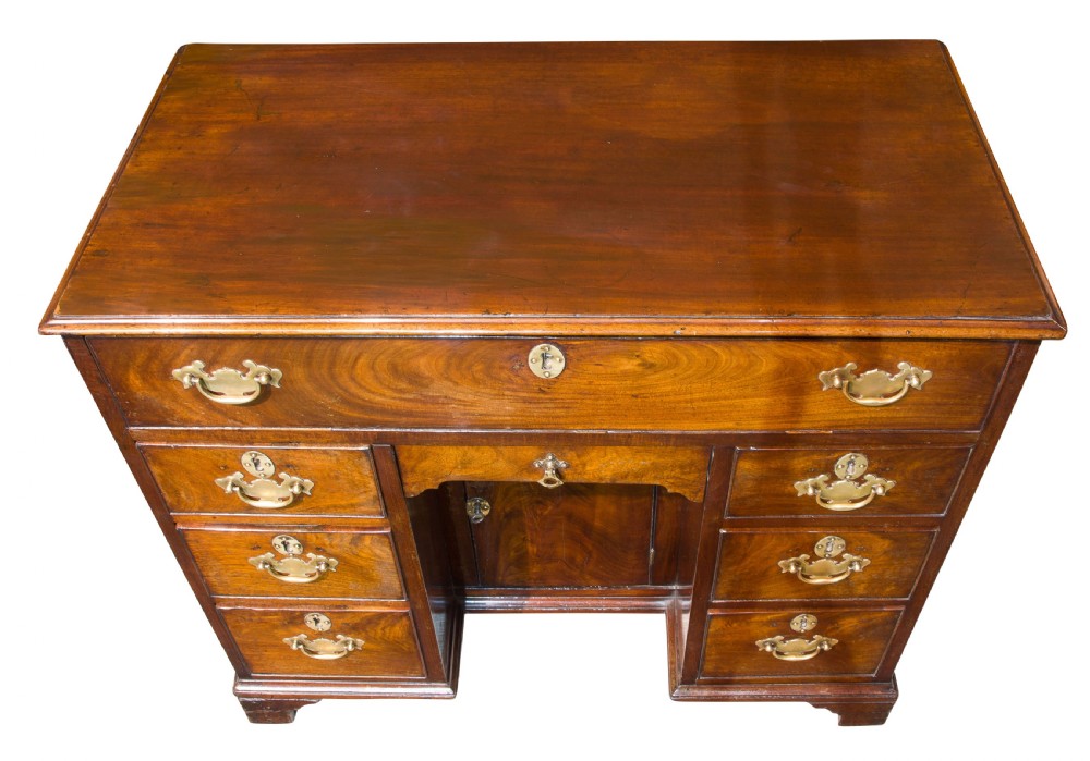 A George III small kneehole desk of six drawers View V