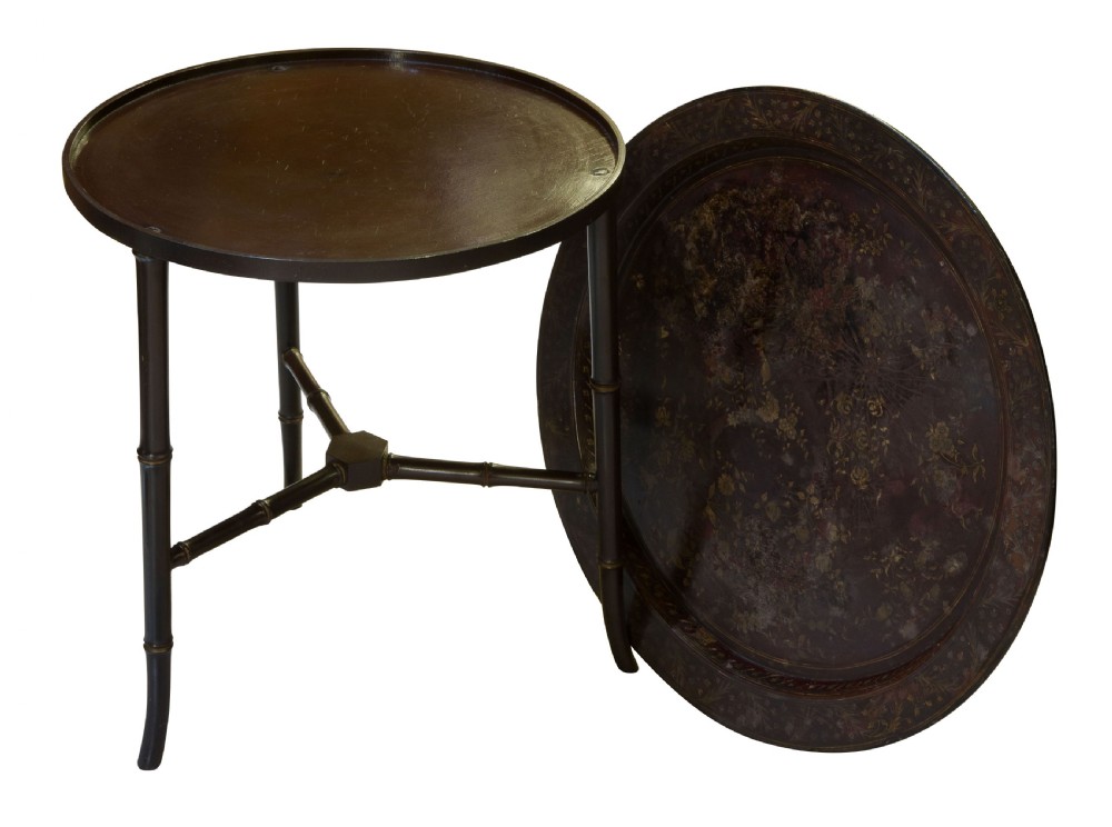 A circular black japanned occasional table featuring a raised tray top and three faux-bamboo turned legs joined by a central stretcher. View II