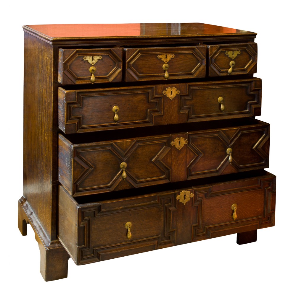 A Queen Anne period oak moulded front chest View II