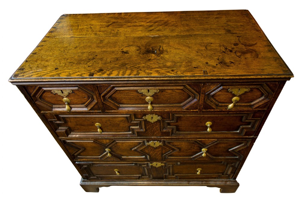 A Queen Anne period oak moulded front chest View V