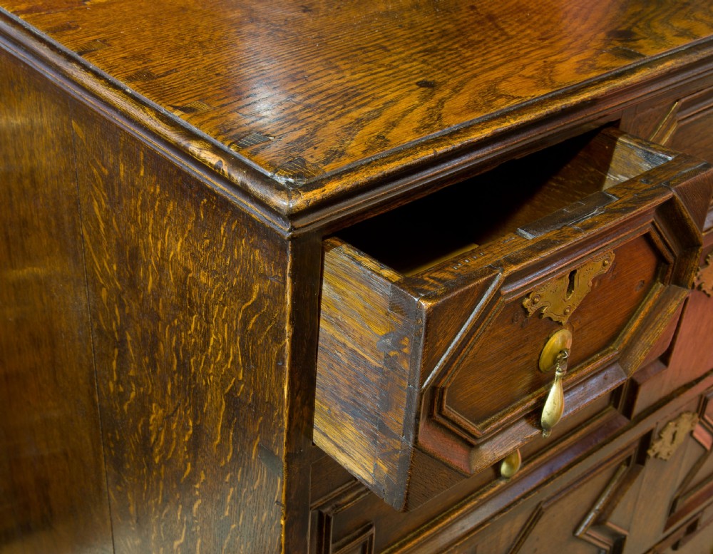 A Queen Anne period oak moulded front chest View VI