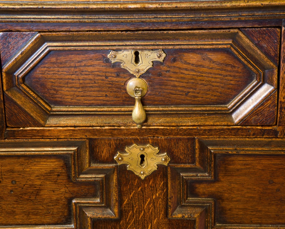 A Queen Anne period oak moulded front chest View VII