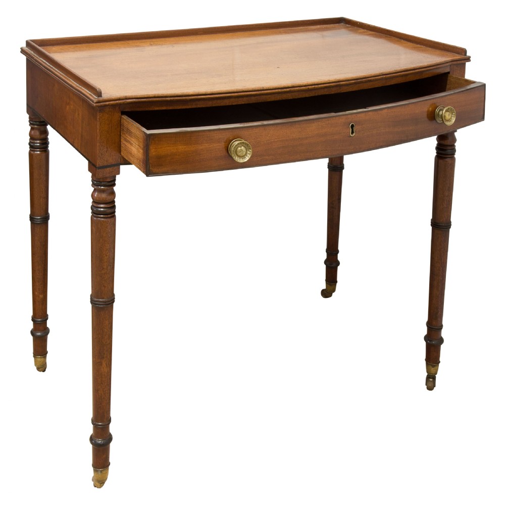 A George III mahogany bow fronted side table View II