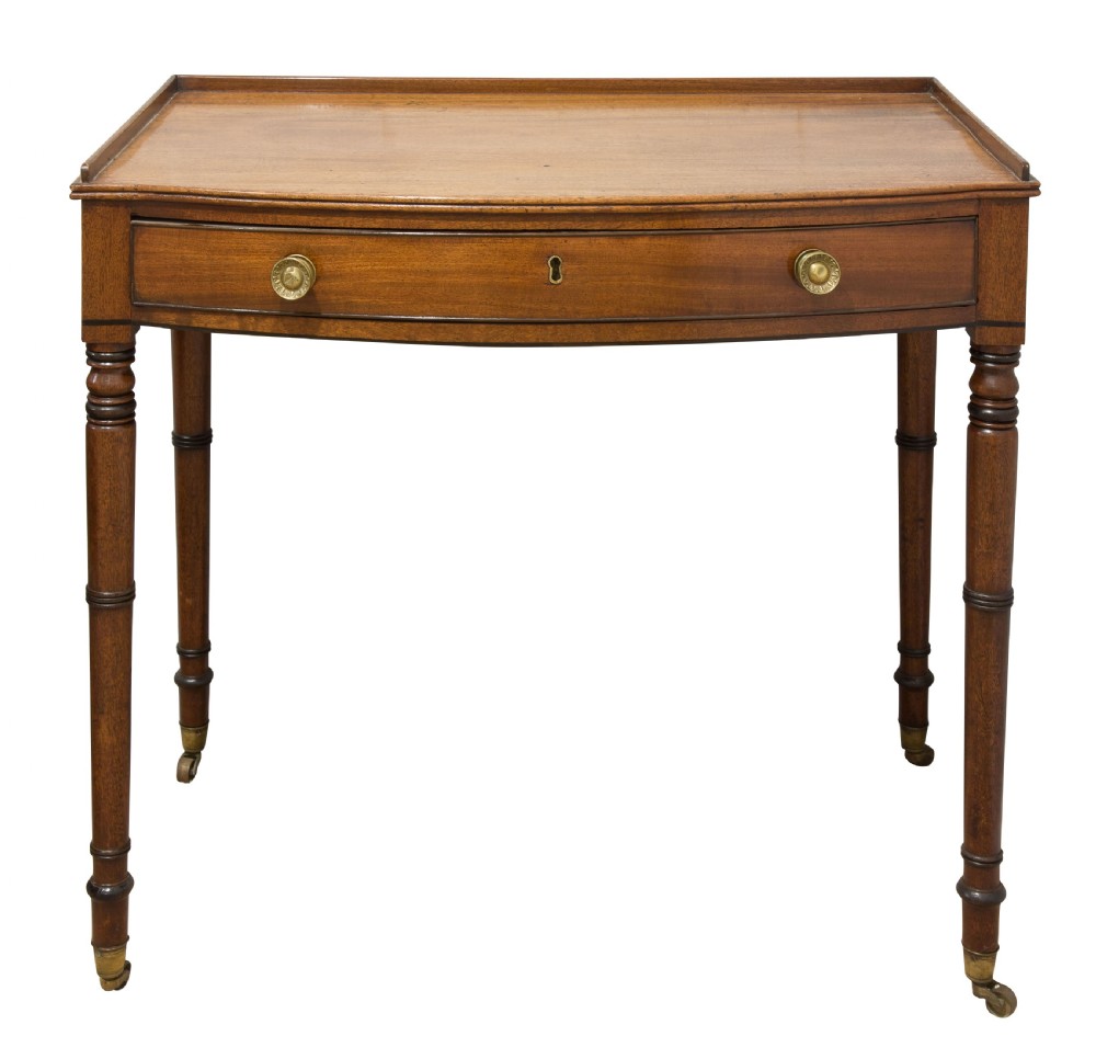 A George III mahogany bow fronted side table View III