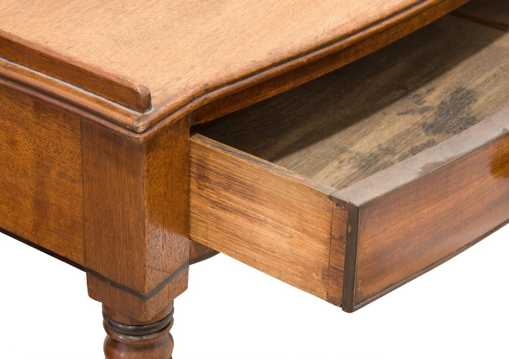 A George III mahogany bow fronted side table View V