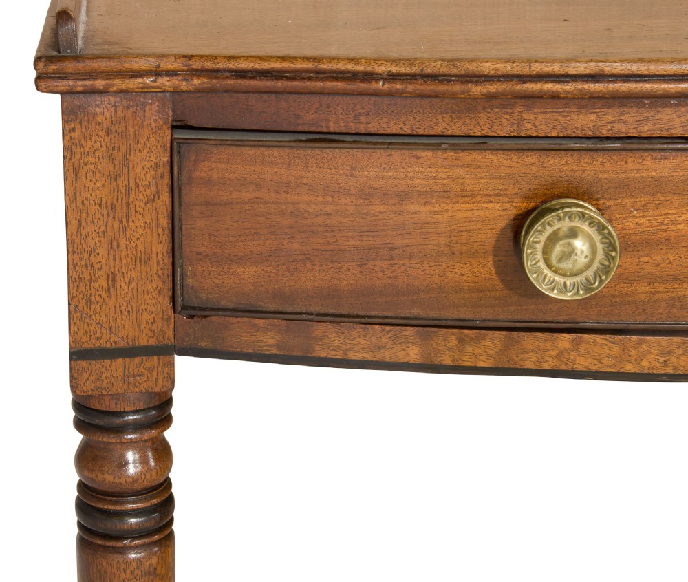 A George III mahogany bow fronted side table View VII