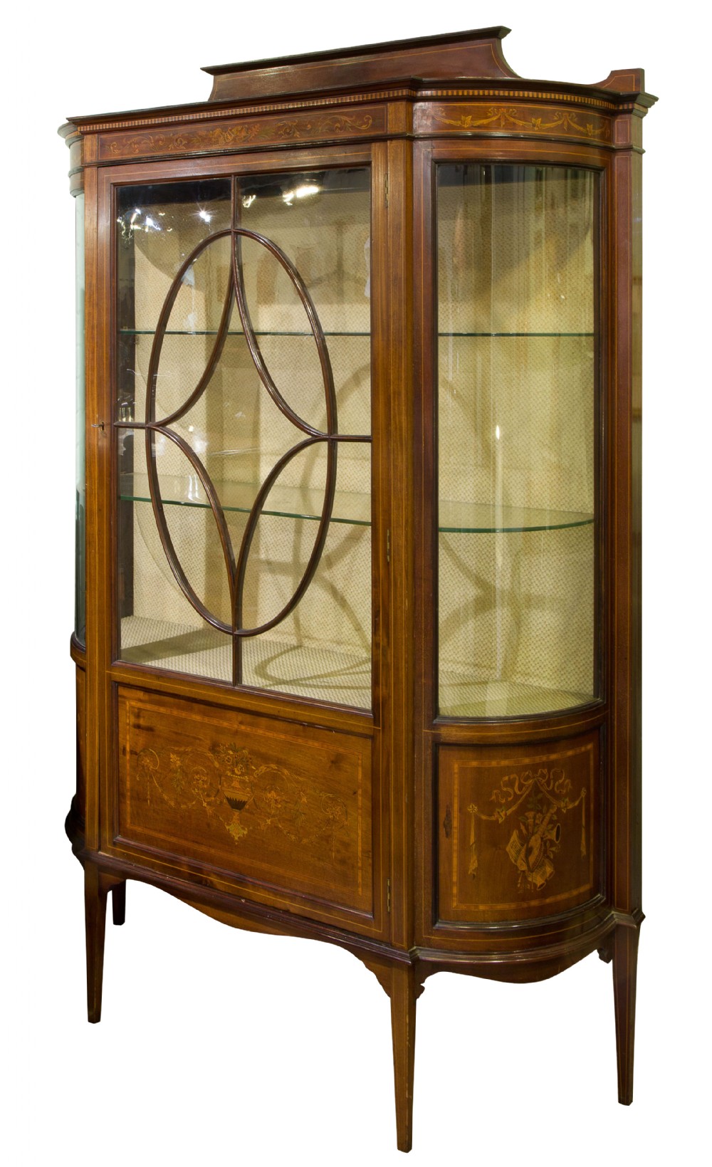 A fine 19thc mahogany bow ended display cabinet