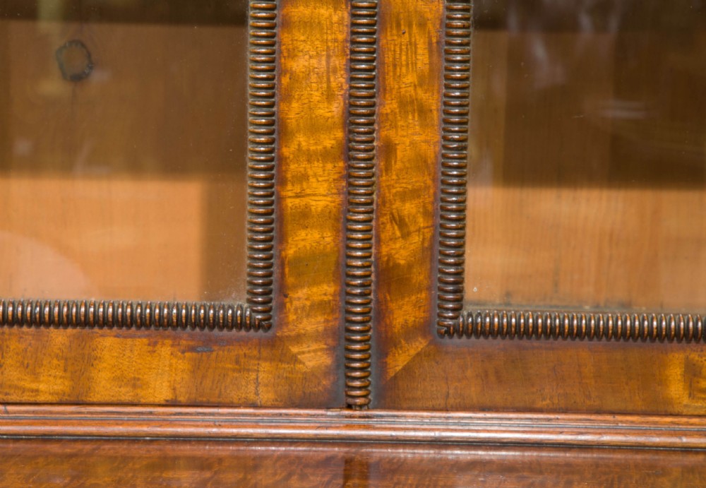 A very fine Regency figured mahogany 2 part bookcase View VII