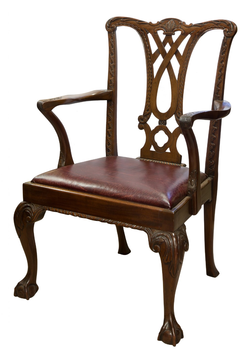 A carved Chippendale style mahogany armchair featuring a pierced back splat, burgundy leather seat, and cabriole legs with ball and claw feet.