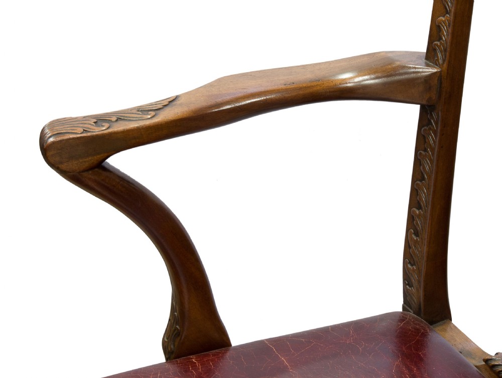 A carved Chippendale style mahogany armchair featuring a pierced back splat, burgundy leather seat, and cabriole legs with ball and claw feet. View IV