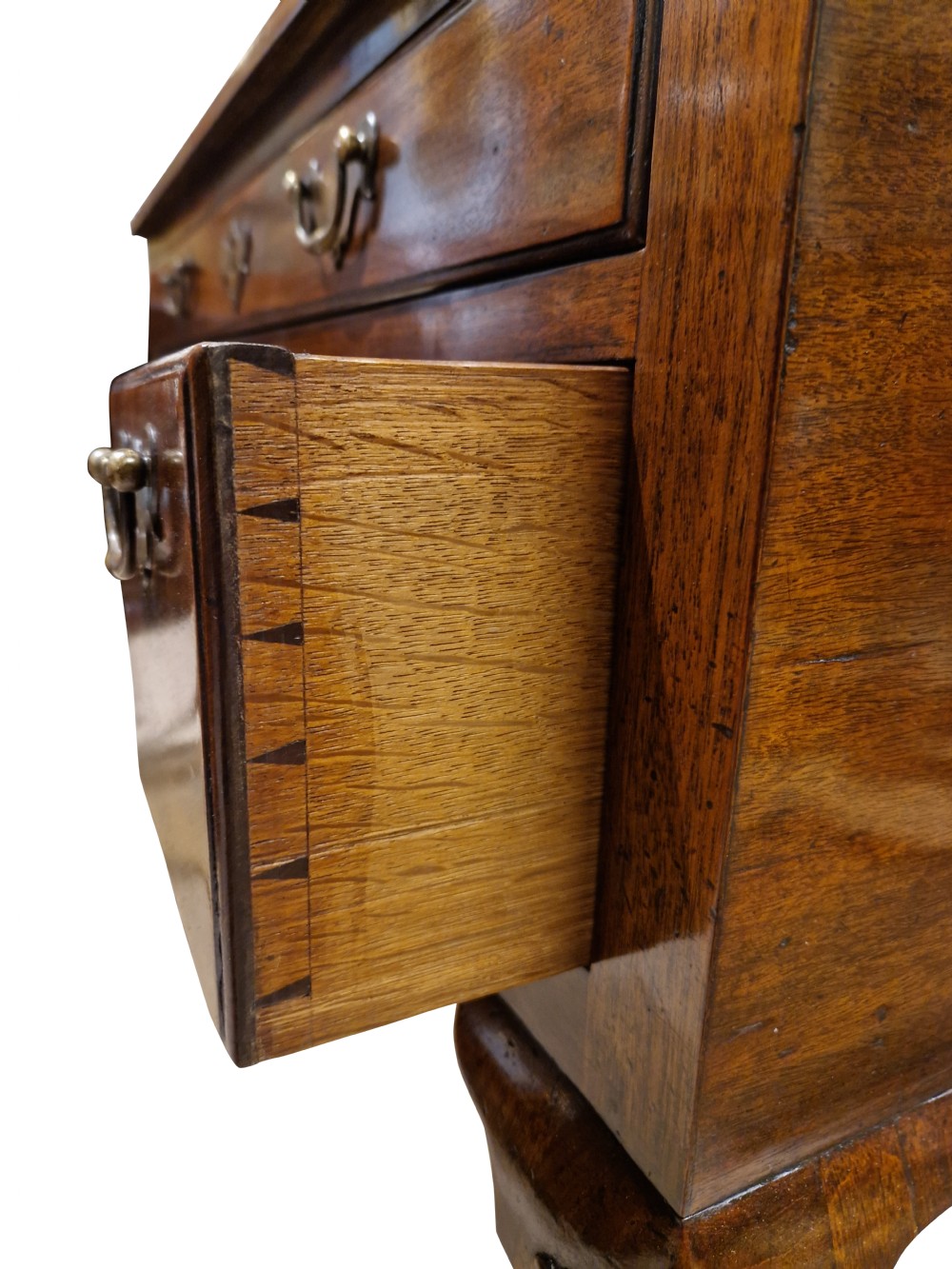 A George II mahogany lowboy table featuring carved cabriole legs, brass drop handles, and four drawers. View V