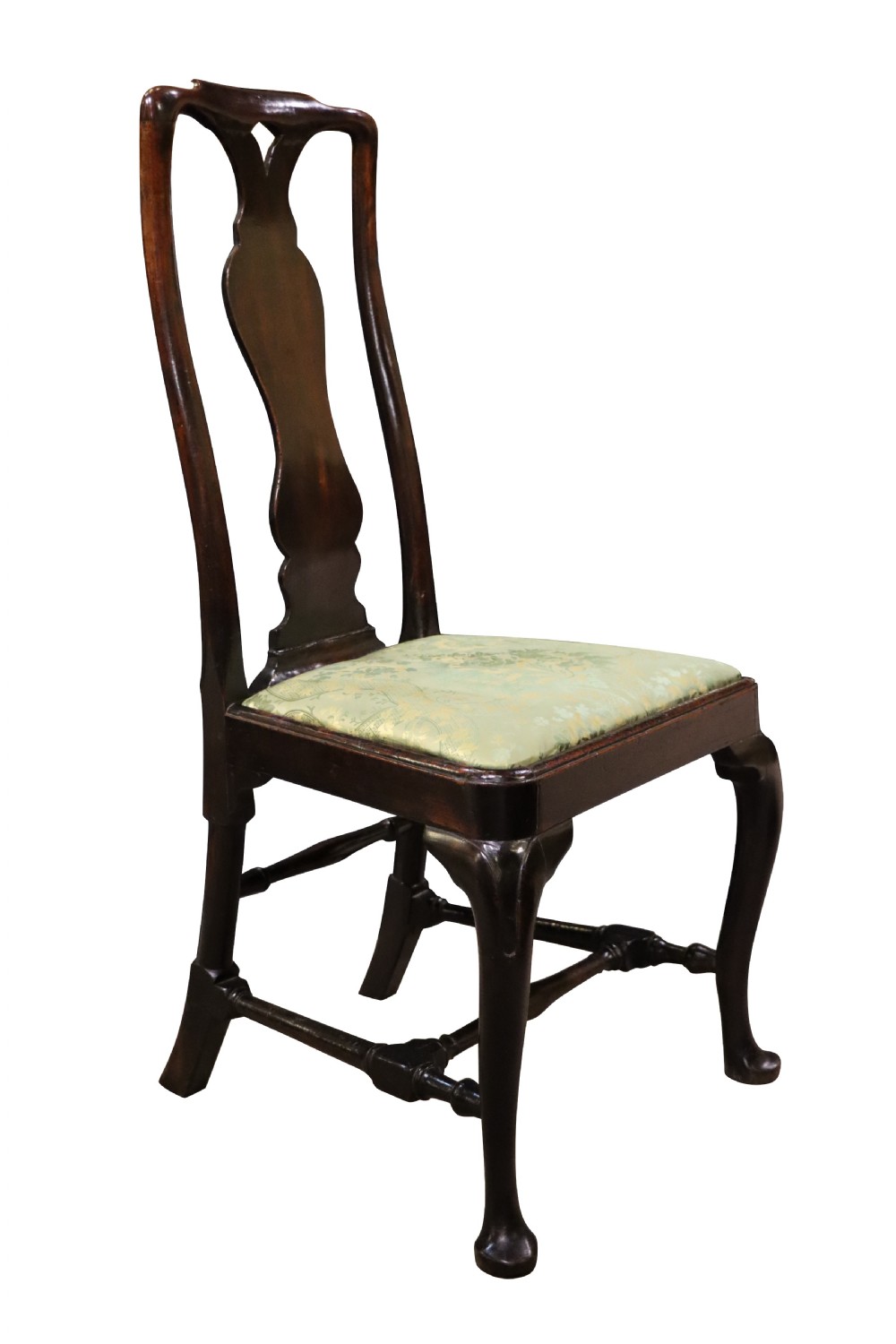 A pair of George I style walnut side chairs featuring high carved backrests with vase splats, cabriole front legs, and green pattern upholstered seats. View V