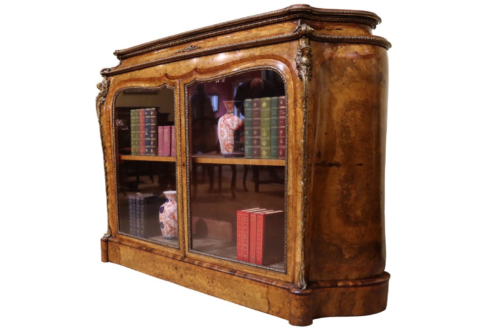 A French Revival burr walnut and kingwood side cabinet featuring two glazed doors, serpentine sides, and gilt-bronze ormolu mounts. View III