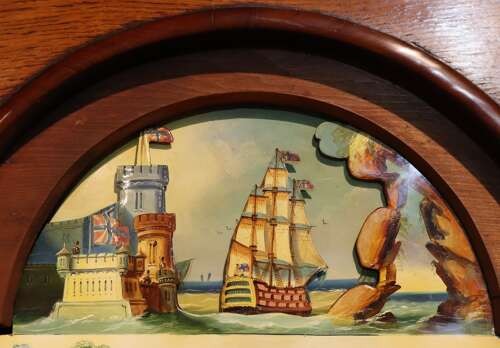 A late 18th-century Welsh oak longcase clock with a swan-neck pediment, spiral side columns, and a hand-painted dial featuring a ship illustration. View IV