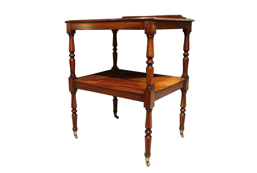 An early 19th-century mahogany two-tier side table featuring turned legs with brass castors and a lower shelf. View IV