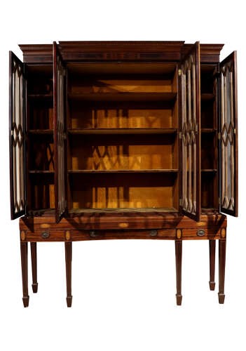 An antique mahogany breakfront display cabinet featuring diamond astragal glazed doors set upon an inlaid stand with square tapered legs. View II