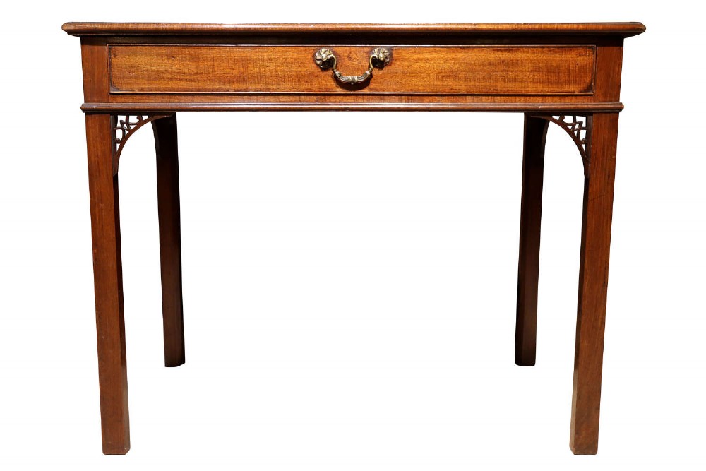 A Georgian mahogany side table featuring a single long drawer with a brass handle, straight square legs, and pierced Gothic corner brackets. View IV