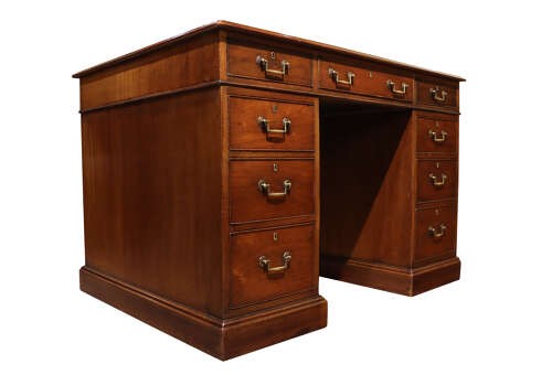 An Edwardian mahogany pedestal desk featuring nine drawers with brass drop handles and a central kneehole opening. View II