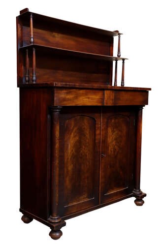 A William IV dark mahogany chiffonier featuring a two-tier shelved upper superstructure supported by turned columns above a two-door cupboard base. View III