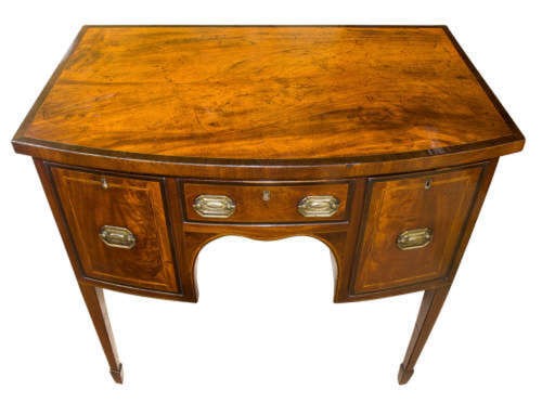 A small George III mahogany bow-front sideboard featuring purpleheart crossbanding, brass handles, an arched central kneehole, and tapered legs. View IV